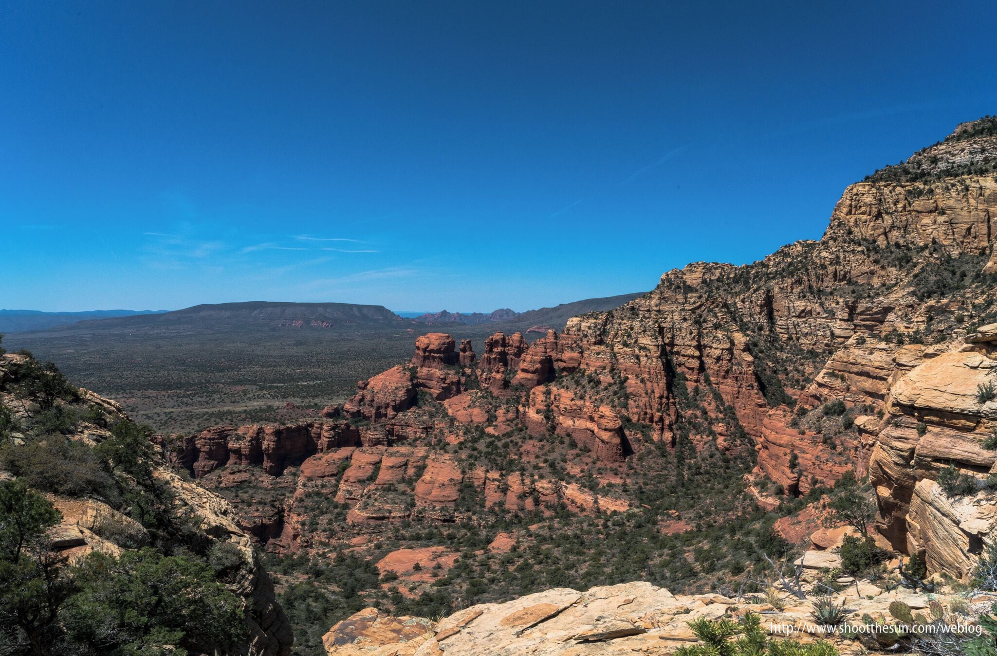 At a mere 6,000 feet (down from the 6,500-foot summit), the San Francisco Peaks are no longer visible, but some of the details of the smaller and closer rock formations come into focus.