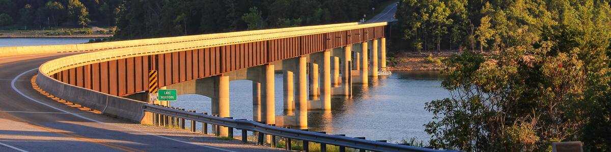 Looking out over Norfork Lake as the evening sun shines on the Hwy. 101 Bridge in Gamaliel, Arkansas