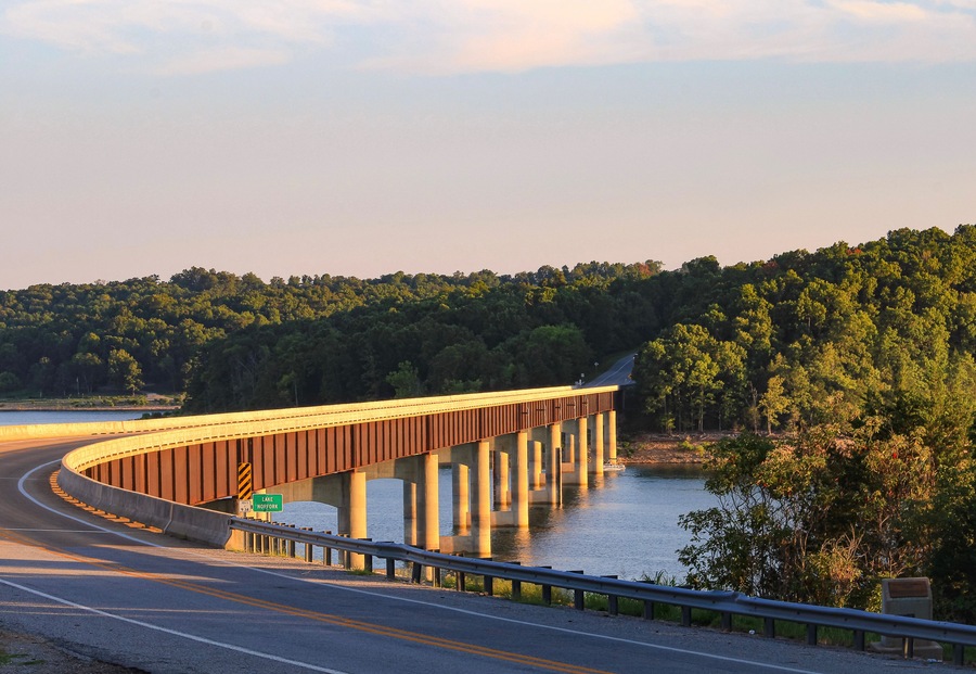 Looking out over Norfork Lake as the evening sun shines on the Hwy. 101 Bridge in Gamaliel, Arkansas