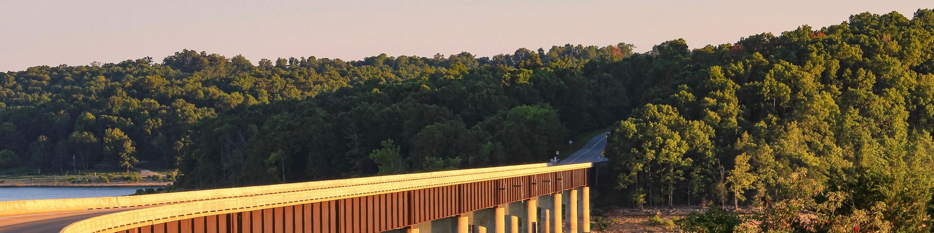 Looking out over Norfork Lake as the evening sun shines on the Hwy. 101 Bridge in Gamaliel, Arkansas