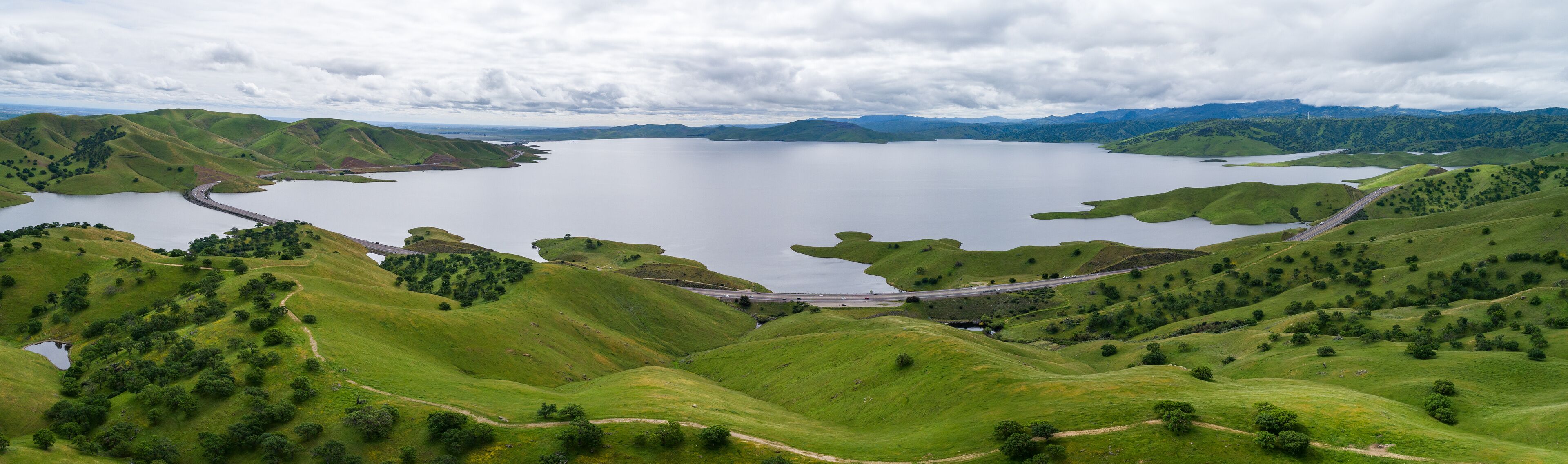 Upper Cottonwood Creek Wildlife Area. Beautiful Nature and Landscape. Green area with Cloudy Sky. Close to San Luis Reservoir. California, USA. Drone
