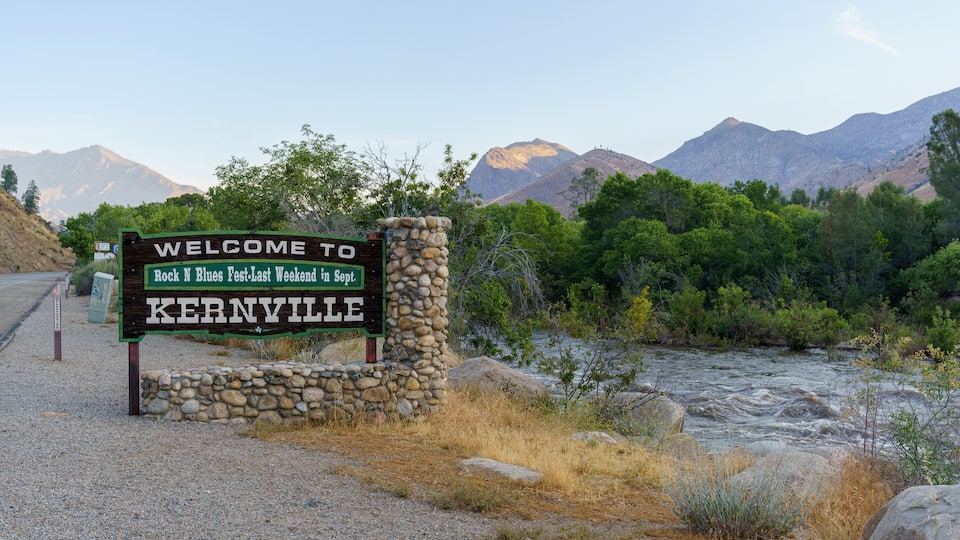 A welcome sign for Kernville with a mountainous backdrop.