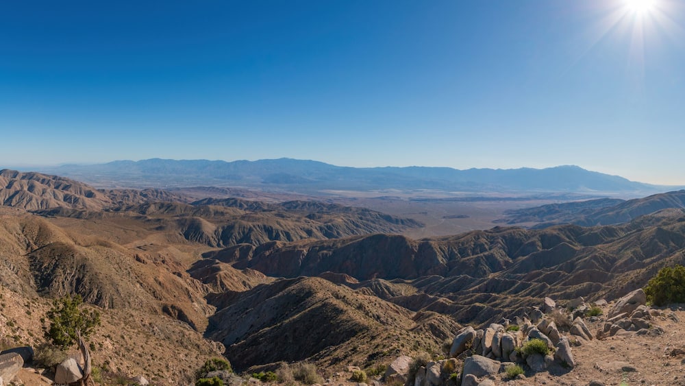 Scenic view from Keys View at Joshua Tree National Park across Little San Bernardino Mountains to Mount San Jacinto, San Andreas Fault and Coachella Valley, California, USA against blue sky