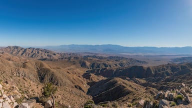 Scenic view from Keys View at Joshua Tree National Park across Little San Bernardino Mountains to Mount San Jacinto, San Andreas Fault and Coachella Valley, California, USA against blue sky