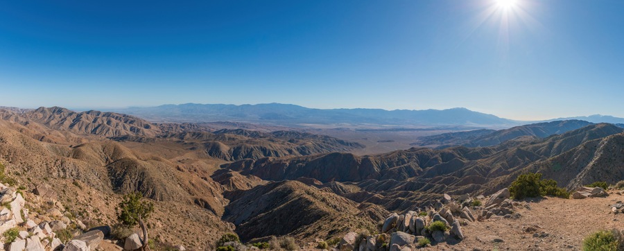Scenic view from Keys View at Joshua Tree National Park across Little San Bernardino Mountains to Mount San Jacinto, San Andreas Fault and Coachella Valley, California, USA against blue sky