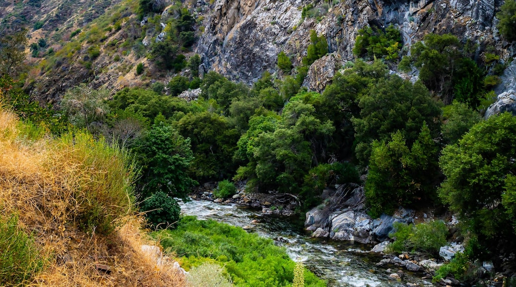 A mountainous landscape with a river flowing through a valley.