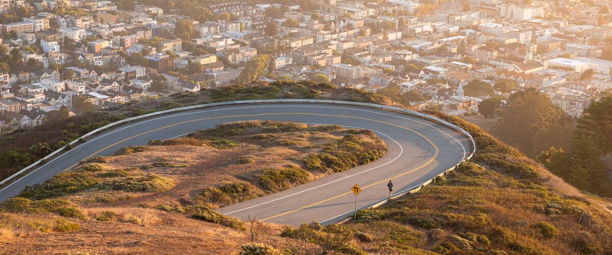 Aerial view over curved road of Twin Peaks, San Francisco.
