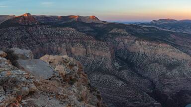 Last light on the desert mountains above the beautiful river canyons of Dinosaur National Monument at sunset.