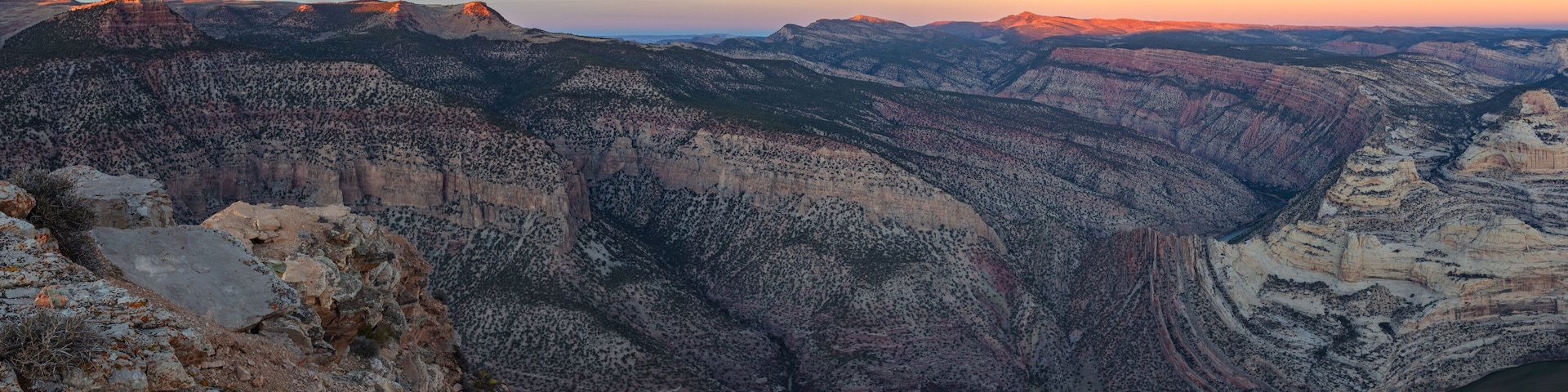 Last light on the desert mountains above the beautiful river canyons of Dinosaur National Monument at sunset.