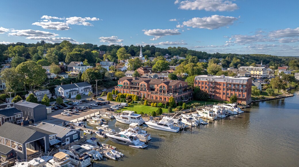 Mystic Connecticut overlooking the scenic Mystic River just south of the Bascule Bridge. Boats, local business, river, and skyline all in high definition beautiful color.