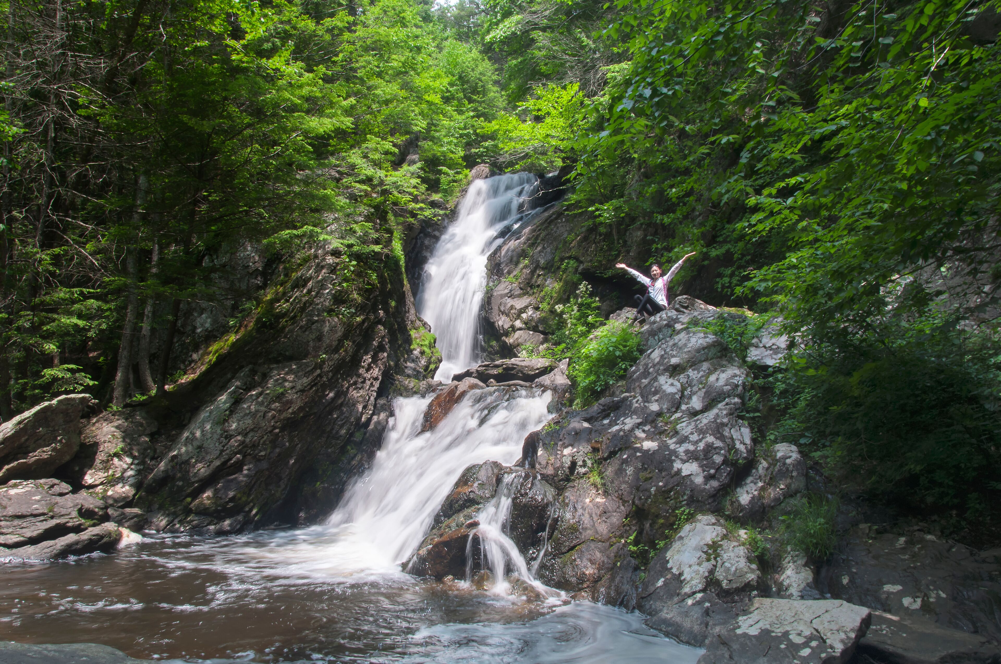 chinese woman celebrating near campbell falls