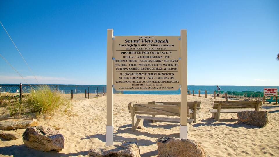 A beach sign listing prohibited activities and rules.