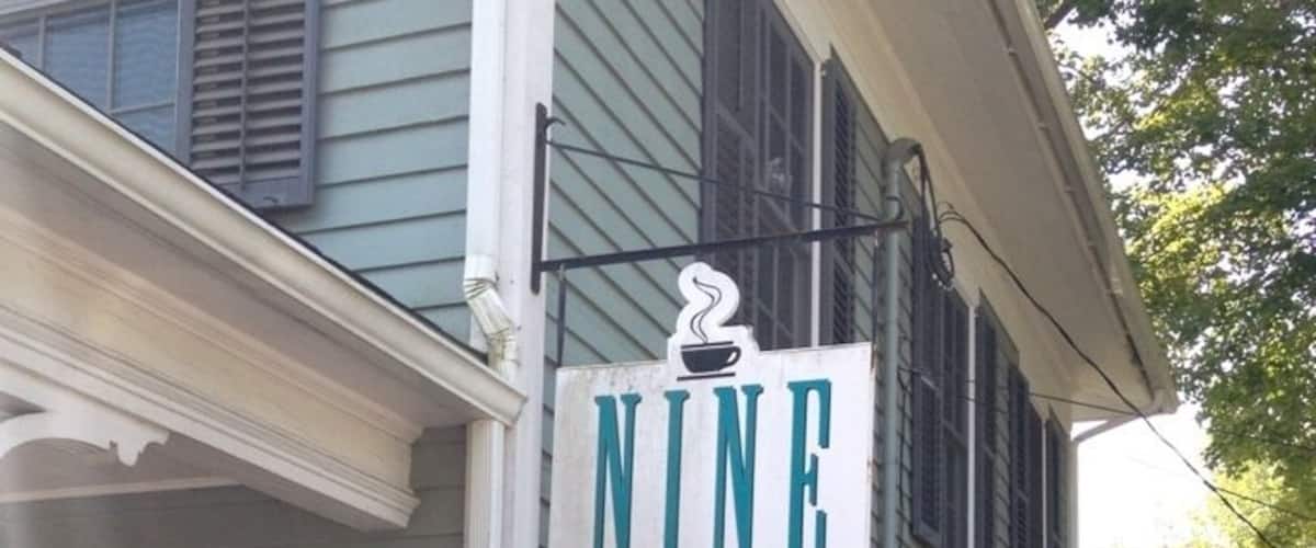 A building with a sign that reads "NINE main Bakery & Deli".