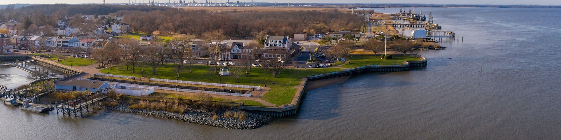 Aerial view of Delaware City New Castle County, Delaware, United States. Small port town on the eastern terminus of the Chesapeake and Delaware Canal with an oil refinery in the background