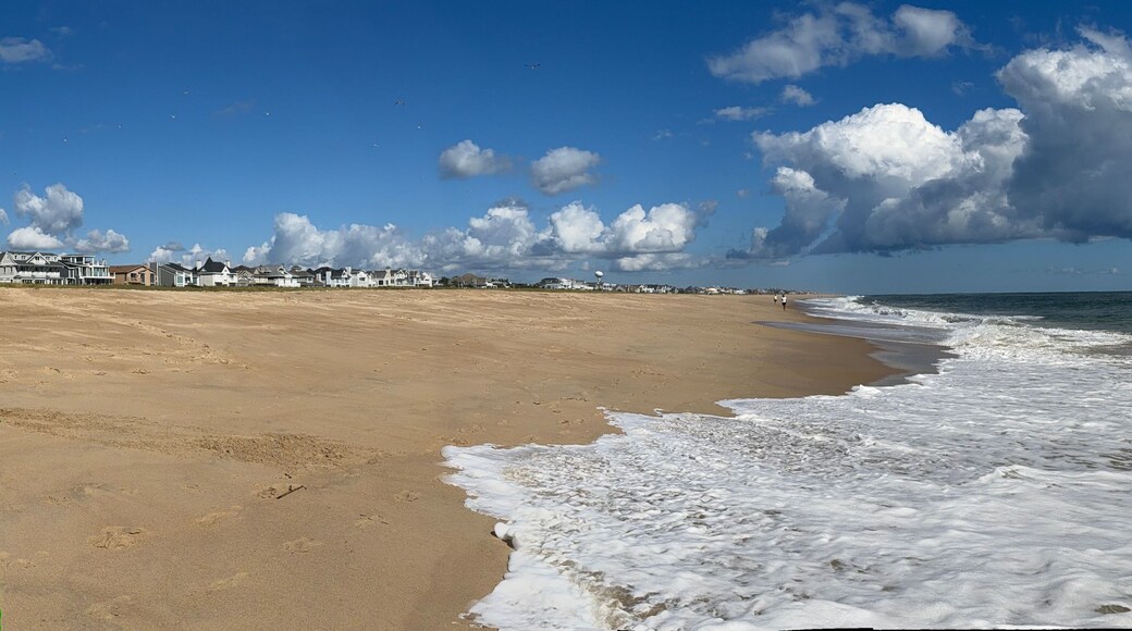 Panorama view of the surf at Bethany Beach in Delaware on Labor Day in early September - the expanse of the Atlantic coast