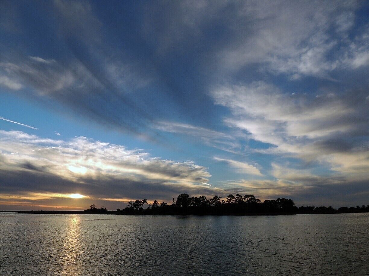 Sunset across the barrier islands of Cedar Key.  

The barrier islands extend 3 miles into the Gulf of Mexico, offering vistas not available along other portions of Florida's west coast.