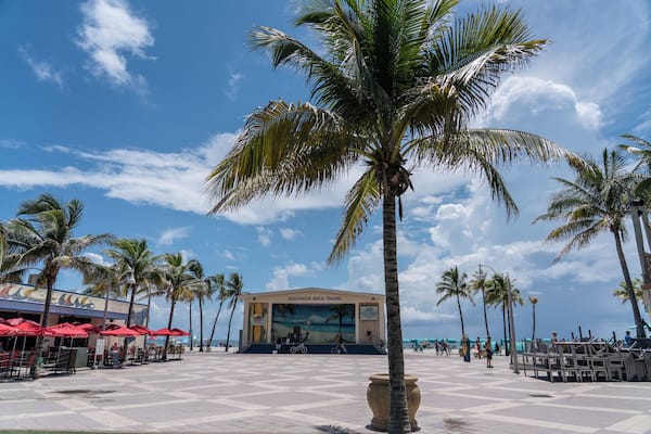 The Hollywood Beach Theatre with palm trees and beachside seating.
