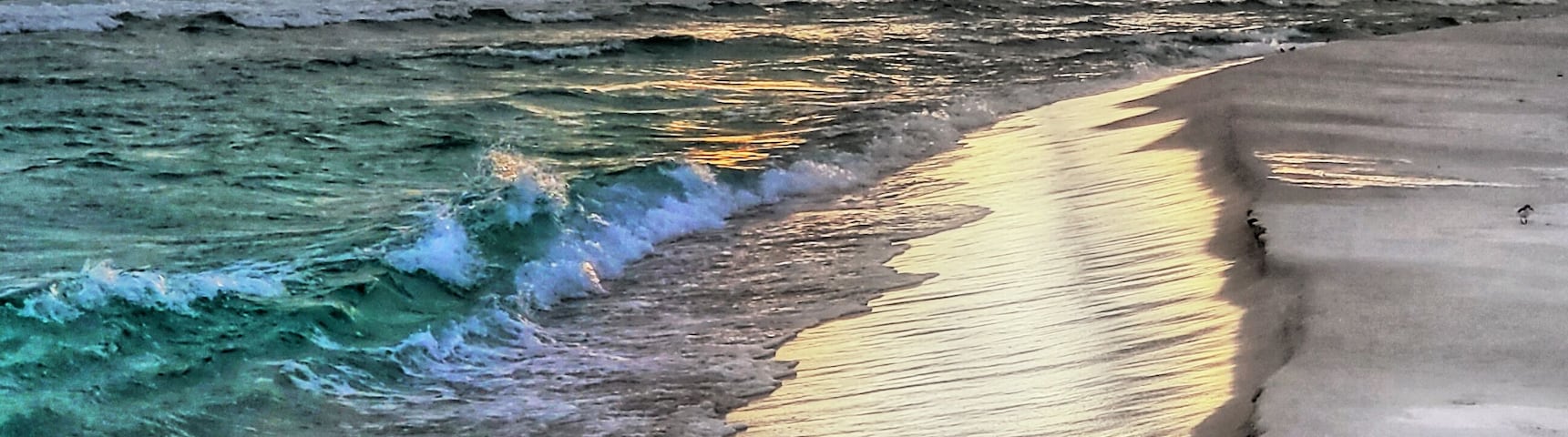 Its white sand beach for miles by hwy 30A.  And right around sunrise and sunset you get some very nice  Light