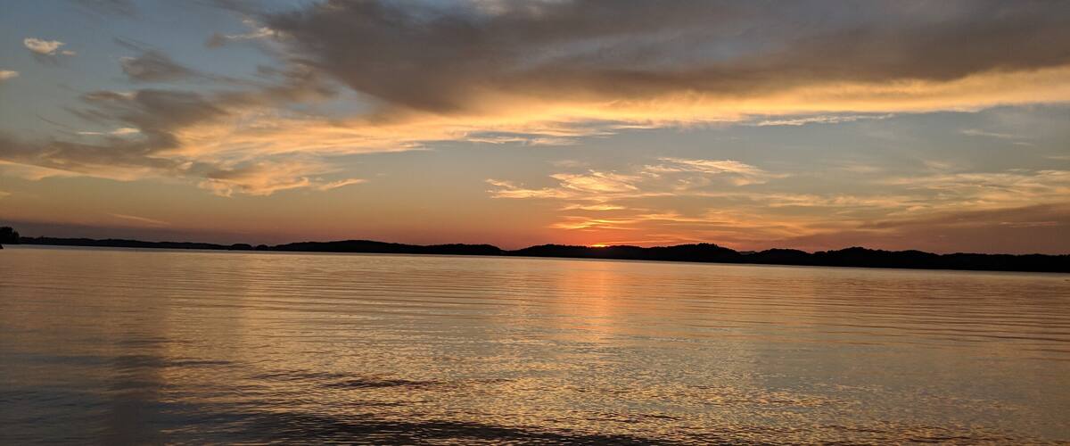 Beautiful sunset over the calm Waters from campsite