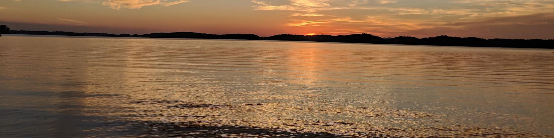 Beautiful sunset over the calm Waters from campsite