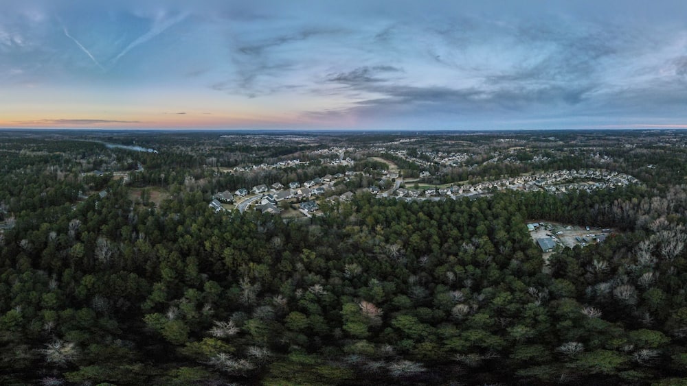 Aerial sunset landscape of forest and suburban neighborhood in Grovetown Augusta Georgia