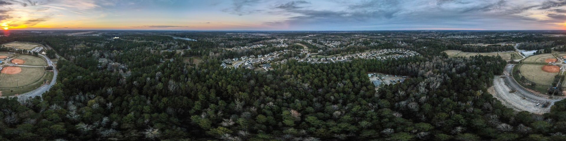 Aerial sunset landscape of forest and suburban neighborhood in Grovetown Augusta Georgia