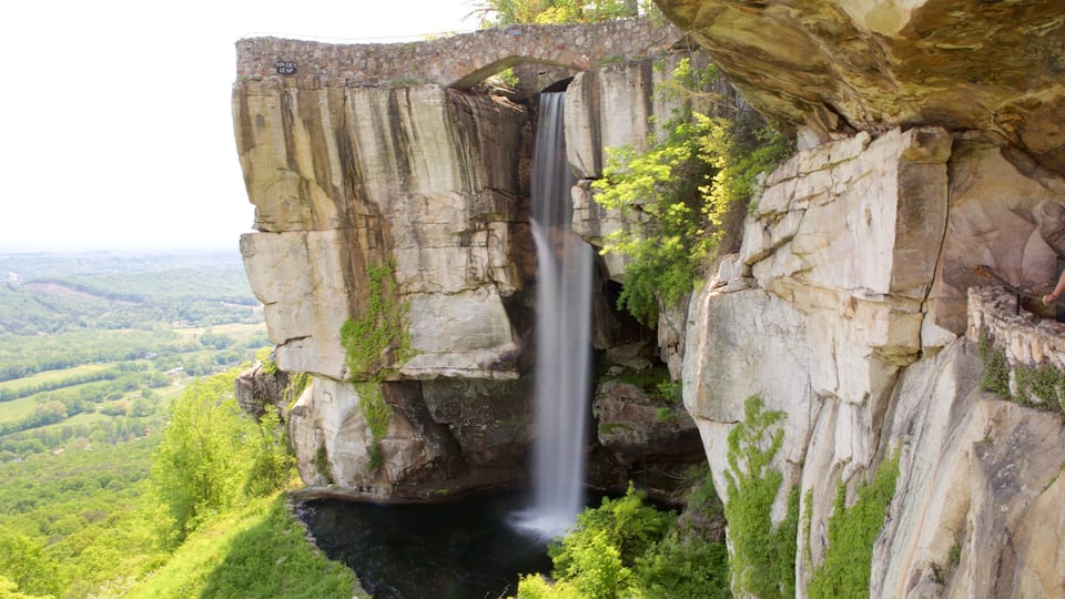 A waterfall cascading down a rocky cliff with a stone bridge labeled "Lovers Leap" above it.