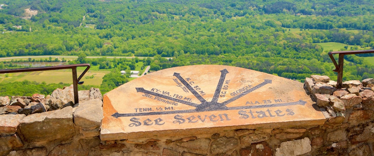 A stone marker with distance markers to various states.