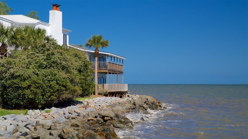 St. Simons Island which includes general coastal views, rocky coastline and a house