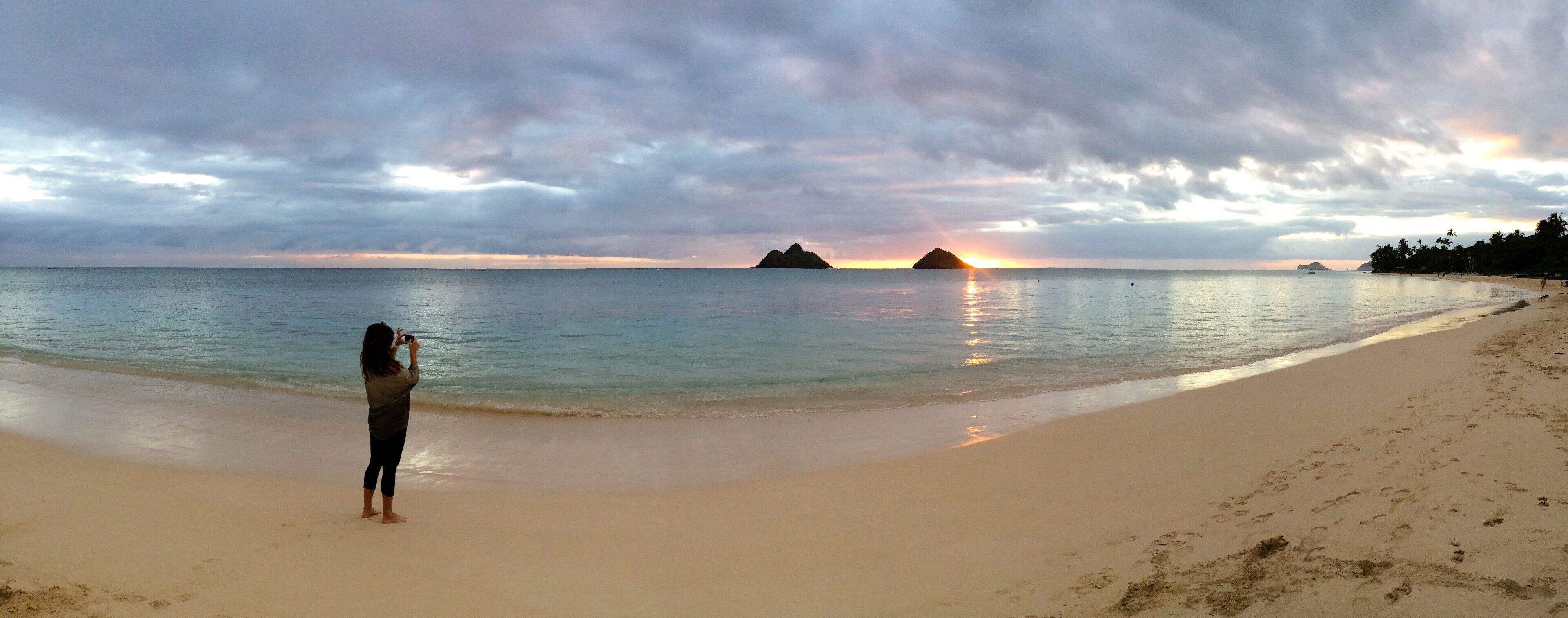 I have photographed the beautiful Lanikai Beach from so many angles, but sunrise is by far my favorite. Before anybody shows up on the beach, when the sea is calm and cotton candy colors dance across a clouded sky. I snapped this photo of my best friend taking a photo.

#panorama
#lanikai
#beaches
#lifeatexpedia
#sunrise