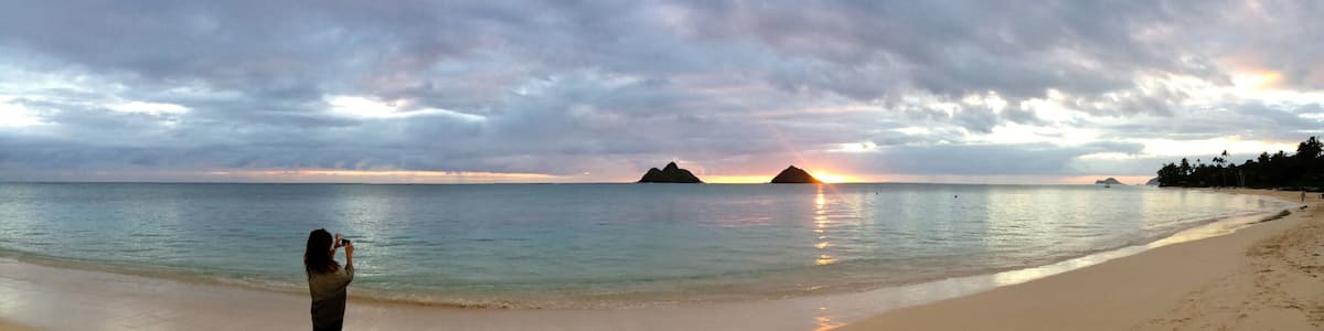 I have photographed the beautiful Lanikai Beach from so many angles, but sunrise is by far my favorite. Before anybody shows up on the beach, when the sea is calm and cotton candy colors dance across a clouded sky. I snapped this photo of my best friend taking a photo.
#panorama
#lanikai
#beaches
#lifeatexpedia
#sunrise