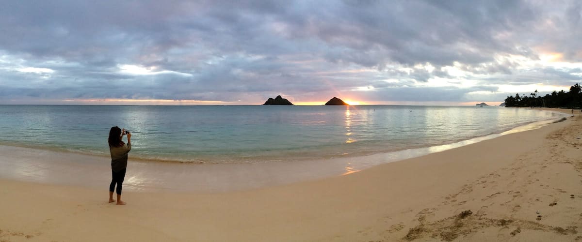 I have photographed the beautiful Lanikai Beach from so many angles, but sunrise is by far my favorite. Before anybody shows up on the beach, when the sea is calm and cotton candy colors dance across a clouded sky. I snapped this photo of my best friend taking a photo.
#panorama
#lanikai
#beaches
#lifeatexpedia
#sunrise