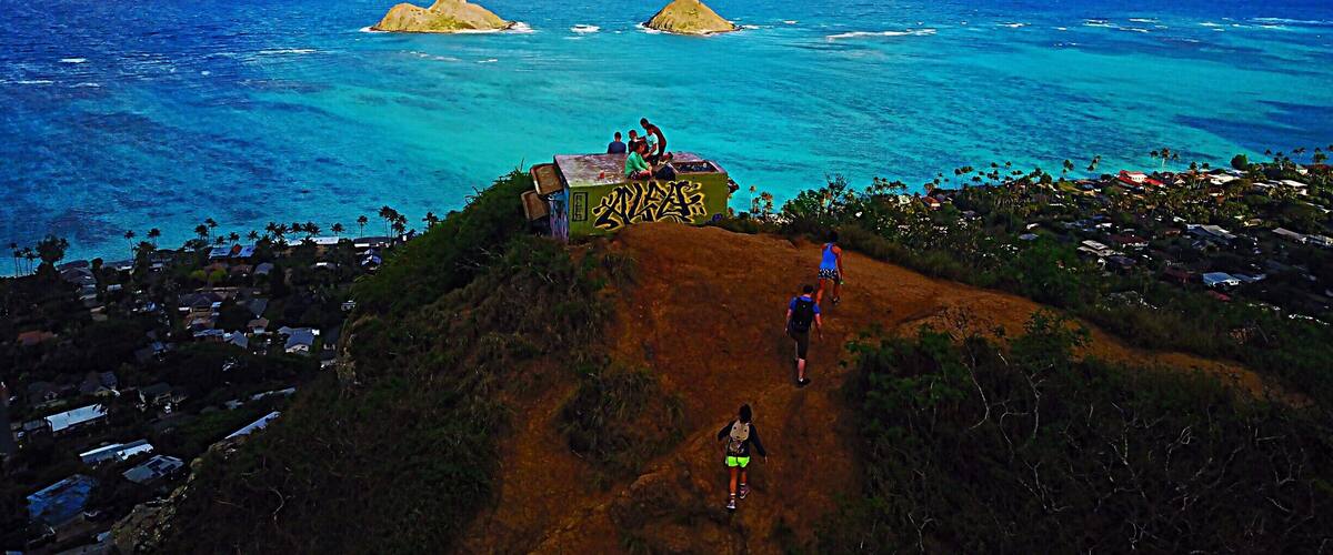 With a spectacular view of Lanikai Beach below, Lanikai Pillboxes Hike is one of my favorite places on Oahu, HI. In the distance you can see The Mokes islands. The hike is pretty short, maybe a half hour to hour up to the top where there are a few pillboxes like the one in this photo. #lifeatexpedia