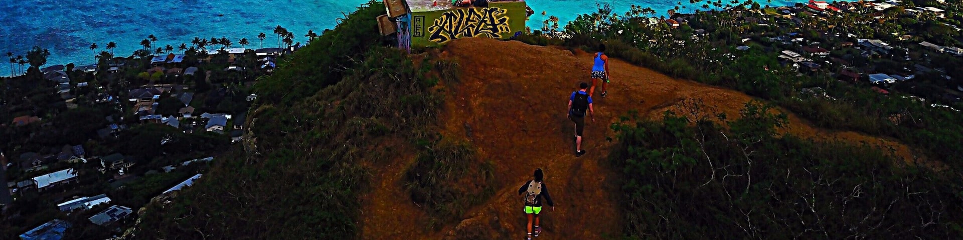 With a spectacular view of Lanikai Beach below, Lanikai Pillboxes Hike is one of my favorite places on Oahu, HI. In the distance you can see The Mokes islands. The hike is pretty short, maybe a half hour to hour up to the top where there are a few pillboxes like the one in this photo. #lifeatexpedia