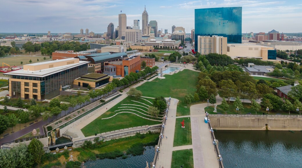 High-angle view of downtown Indianapolis, IN. Parks, buildings, and the White River are visible. People are walking and relaxing. Downtown, Indianapolis, Indiana, United States