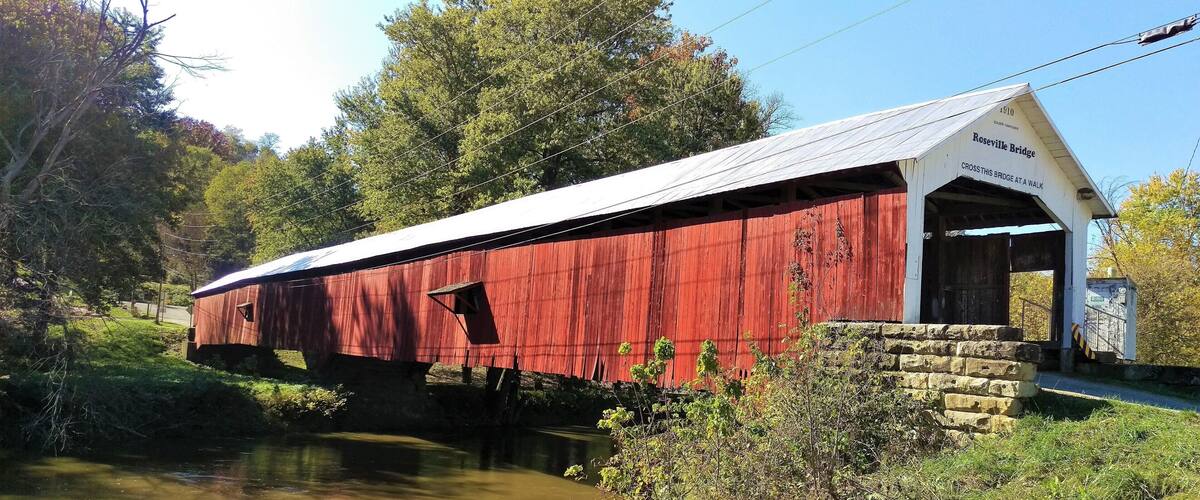 I loved this bridge as it was one of the few that you could actually drive through. At the other end of the covered bridge was a really nice mom and pop restaurant. If you have never experienced the Indiana Covered Bridge Festival you really do need to add it to your list of things to do this summer!
https://midlifemilestones.com/indiana-covered-bridge-festival/