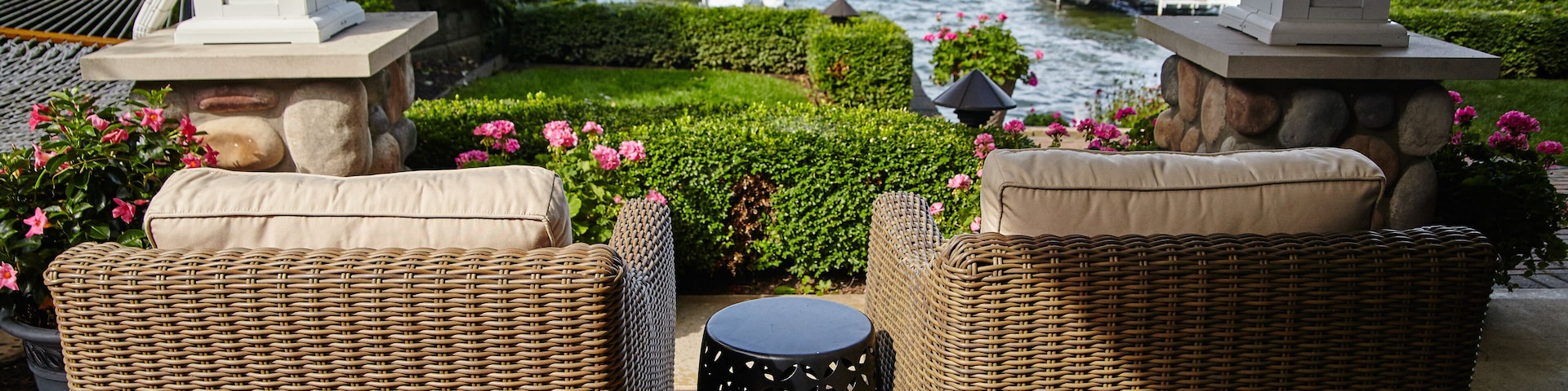 Lakeside Relaxation with Wicker Chairs and American Flag
