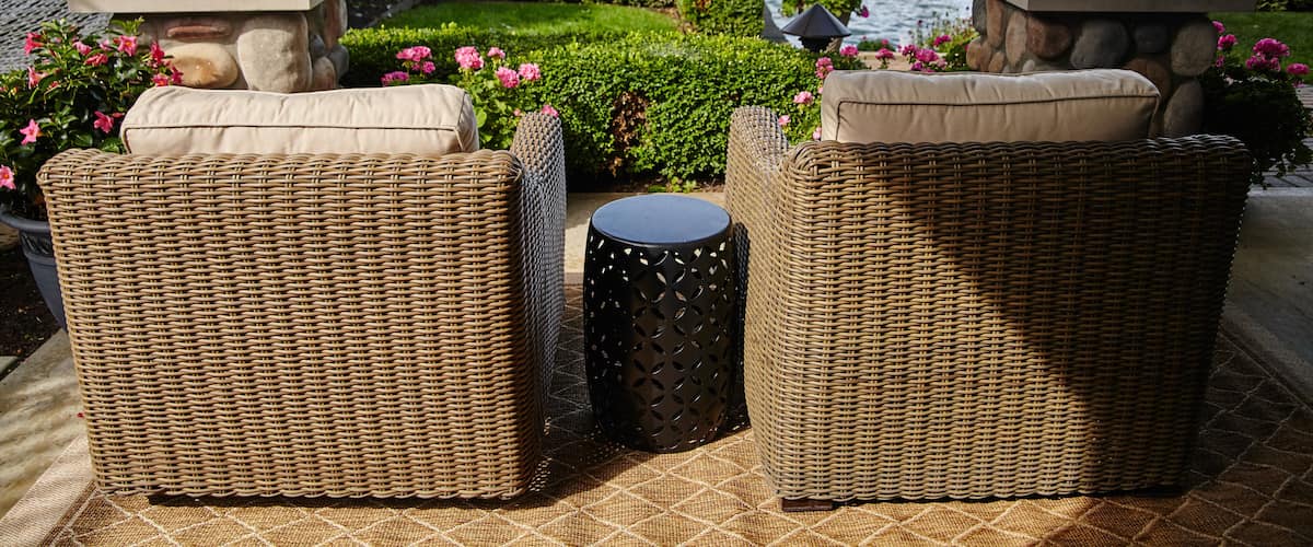 Lakeside Relaxation with Wicker Chairs and American Flag