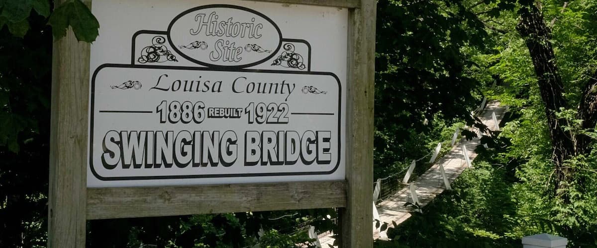 A sign for Louisa County's Swinging Bridge, built in 1886 and rebuilt in 1922.