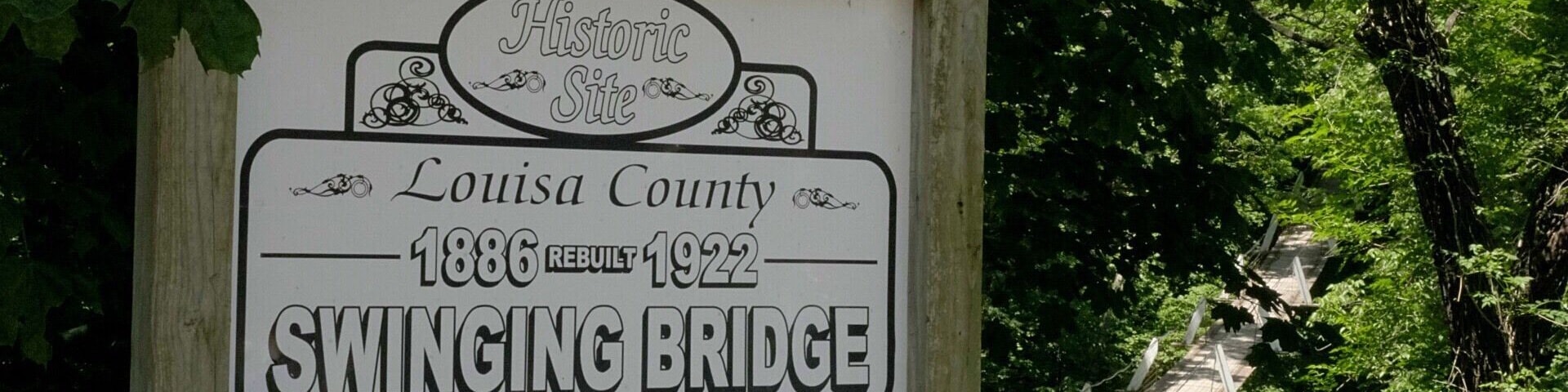A sign for Louisa County's Swinging Bridge, built in 1886 and rebuilt in 1922.
