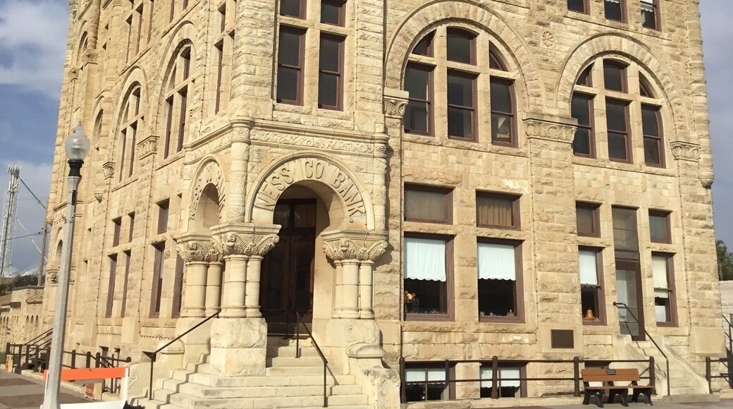 It says Ness Co Bank over he door of this grand stone building in a pretty small town in western KS.