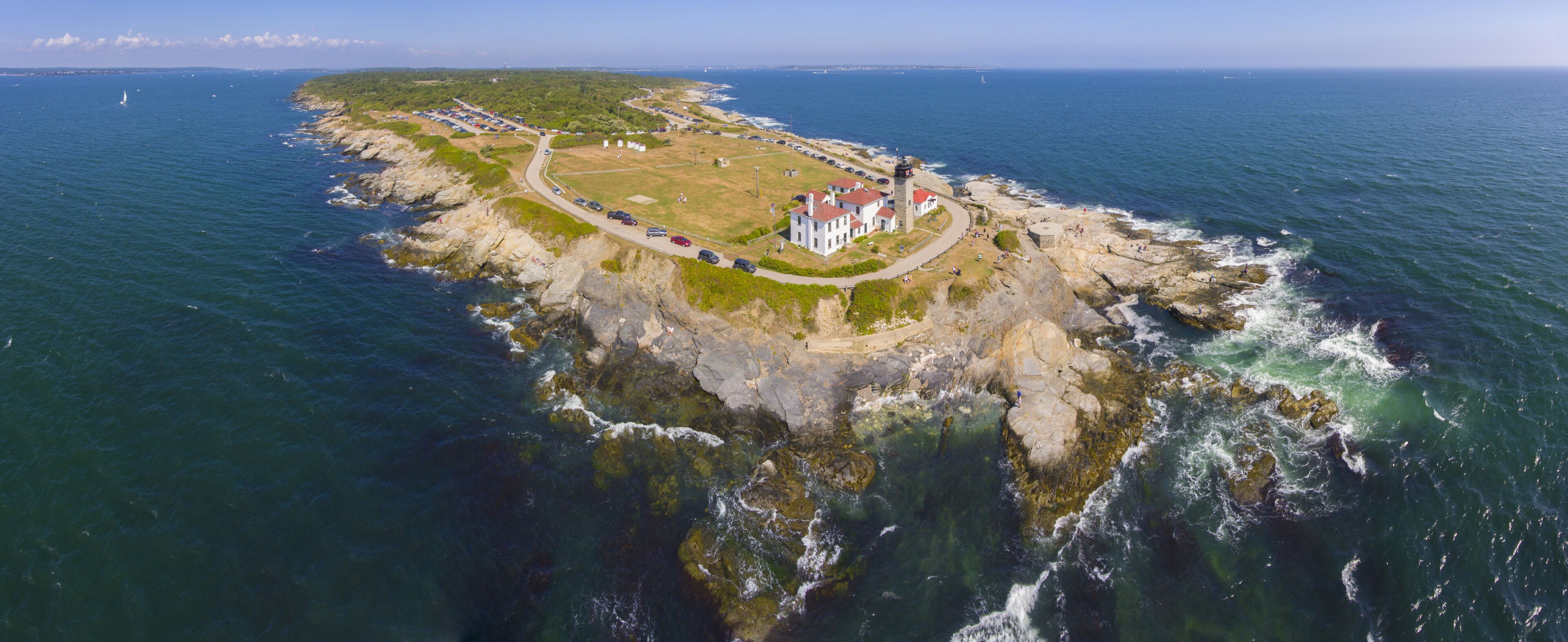 Beavertail Lighthouse in Beavertail State Park aerial view in summer, Jamestown, Rhode Island RI, USA. This lighthouse, built in 1856, at the entrance to Narragansett Bay on Conanicut Island.
