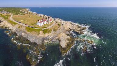 Beavertail Lighthouse in Beavertail State Park aerial view in summer, Jamestown, Rhode Island RI, USA. This lighthouse, built in 1856, at the entrance to Narragansett Bay on Conanicut Island.