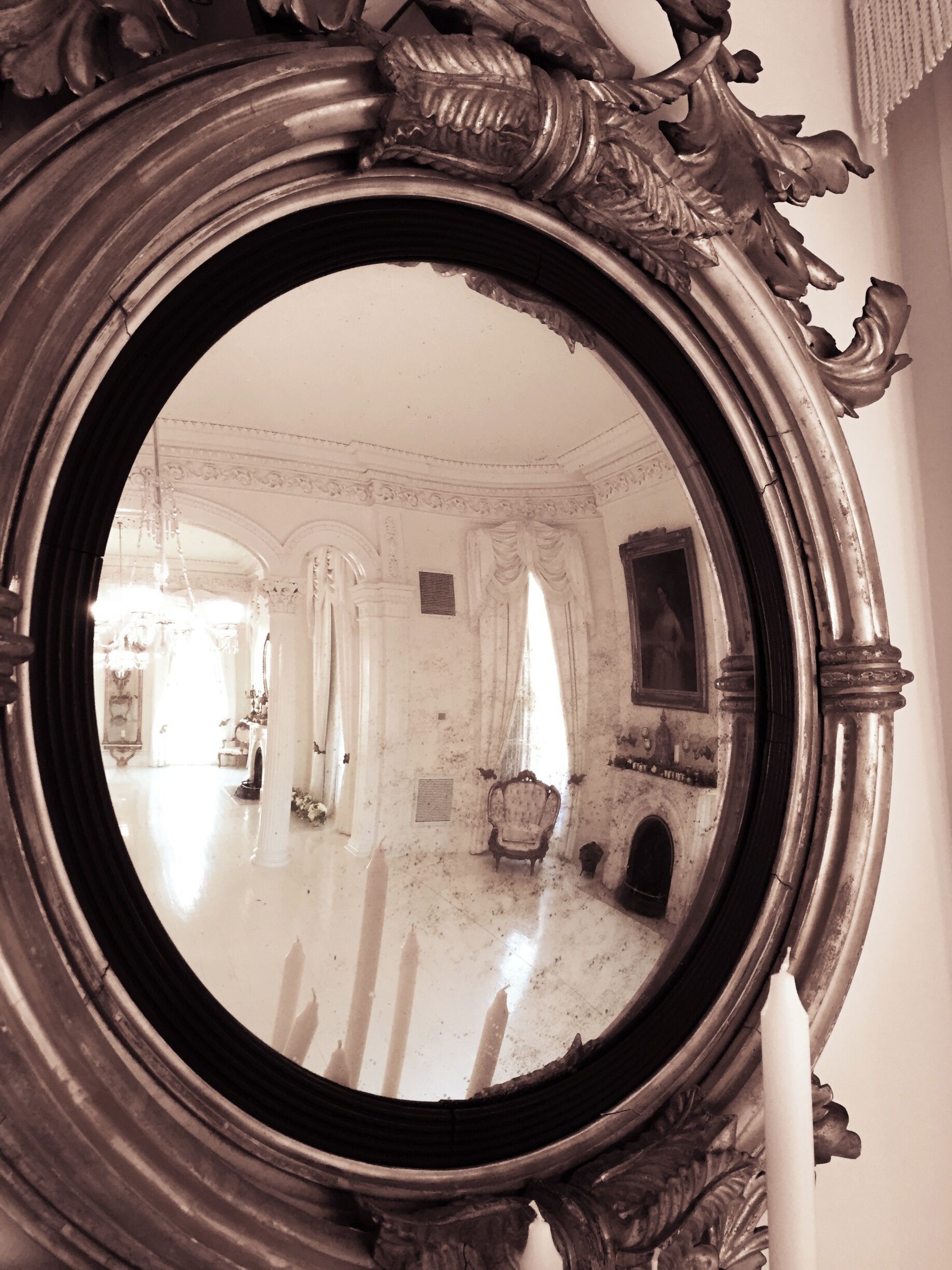 This was a mirror in the White Ballroom.  We were lucky that we got there very early for the first tour of the day, there were like four of us.  We were able to get clear shots across the room.  Not he very left of the mirror you can see the reflection of the full length mirror that was on the other side of the room.

Taken with iPhone 6 and edited with Lightroom.