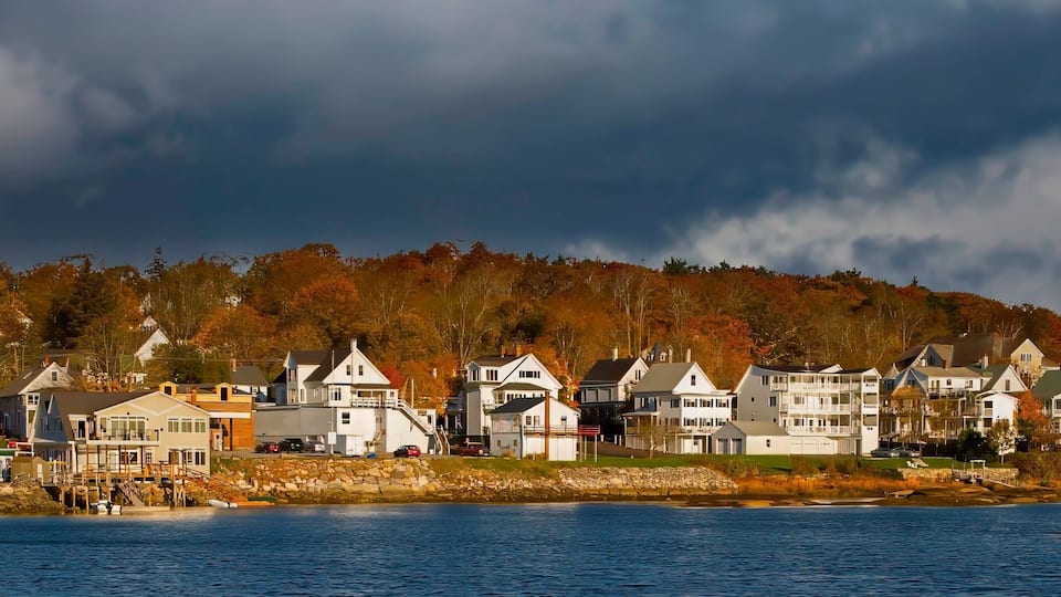 A panorama image of Homes on the waterfront on Boothbay Harbor, Vermont,