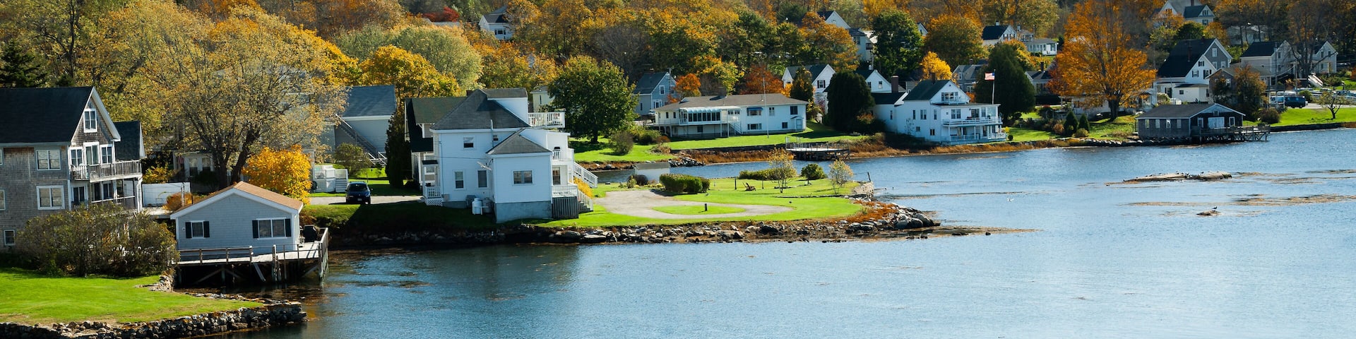 A panorama image of Homes on the waterfront on Boothbay Harbor, Vermont,