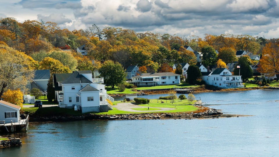 A panorama image of Homes on the waterfront on Boothbay Harbor, Vermont,