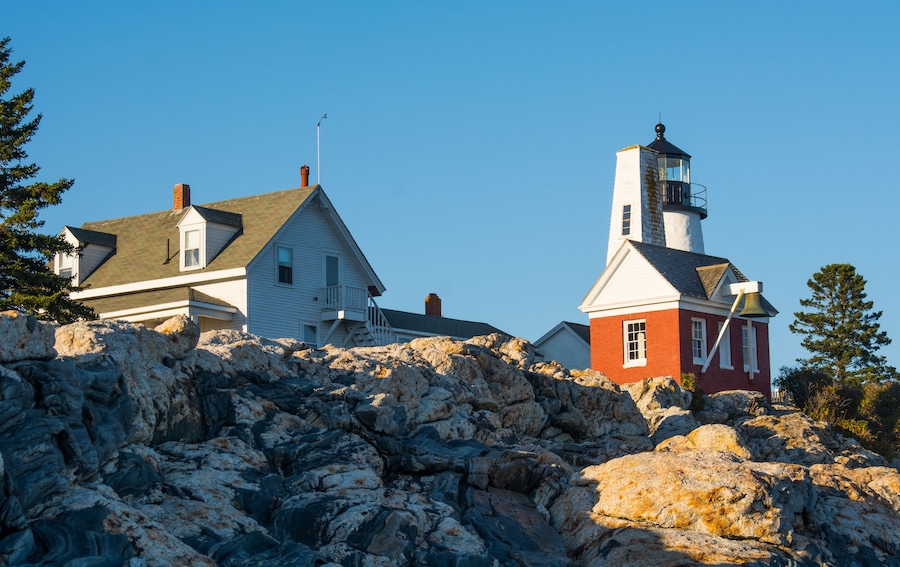 Pemaquid Lighthouse in Bristol, Maine on a sunny day with the coastal rock formations in front.; Shutterstock ID 495740236