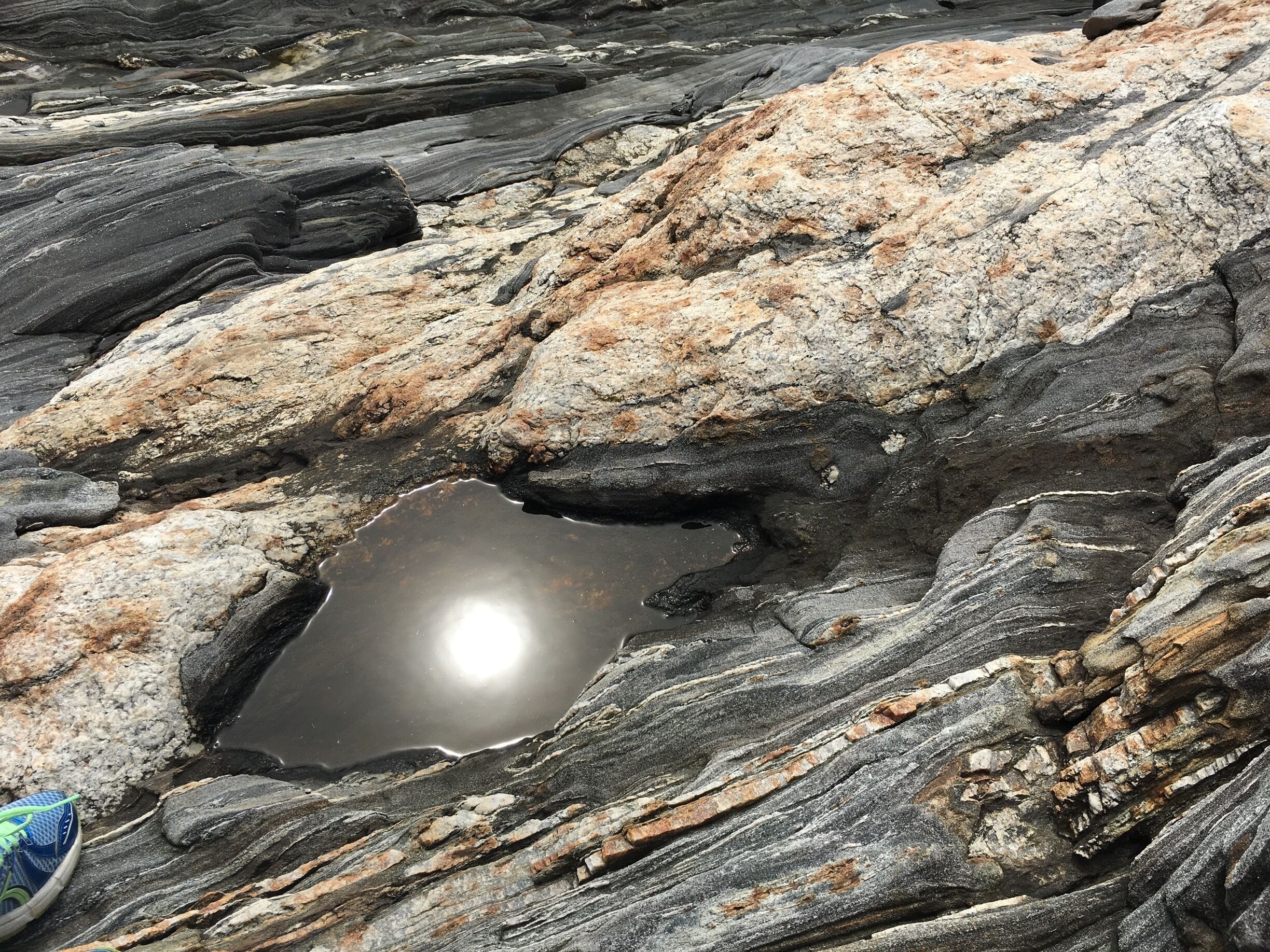 Pemaquid Lighthouse, one of my favorite places, the sun seems to have settled among the rock formations.
