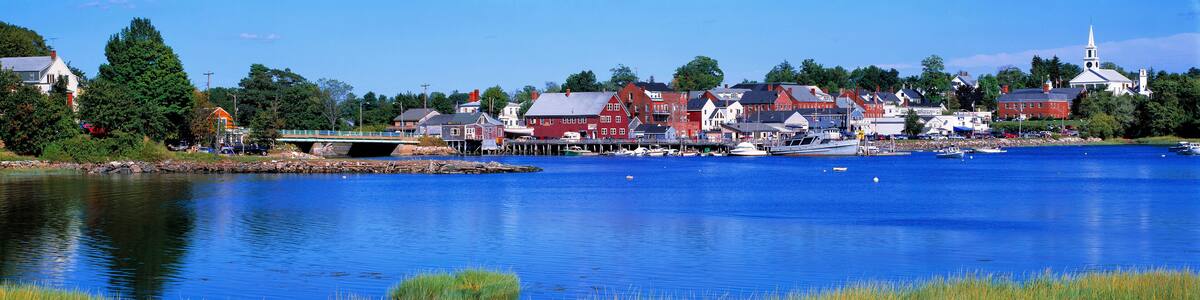 USA, Maine, Damariscotta. The quaint village of Damariscotta, in Lincoln County, Maine, is a montage of bright red and white buildings on its pretty blue harbor.